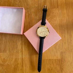 Micheal Kors watch! gold tone face with slim black leather strap.